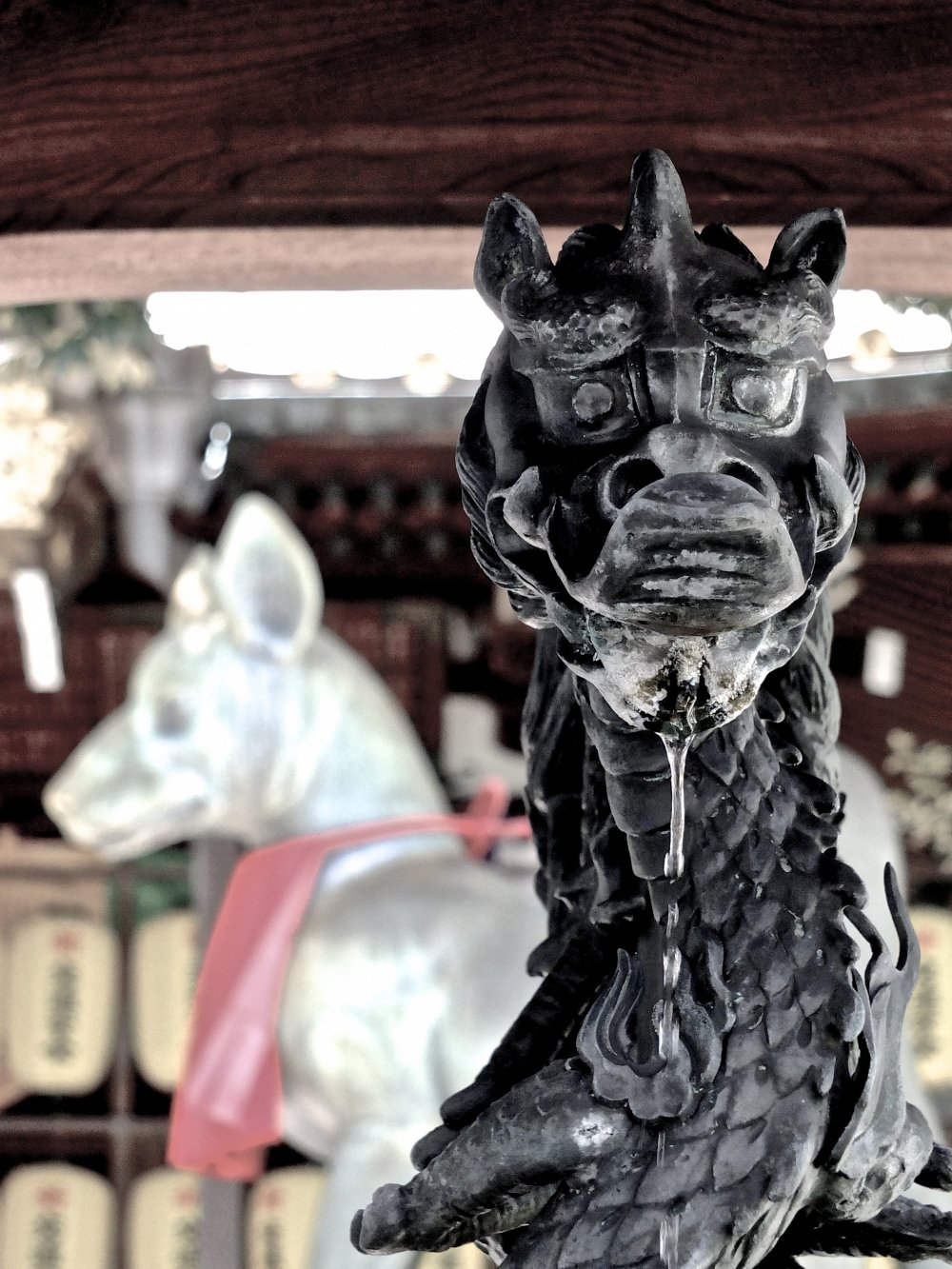 What an interesting combination - a fox and a dragon - at&nbsp;Toyokawa Inari Temple, Akasaka