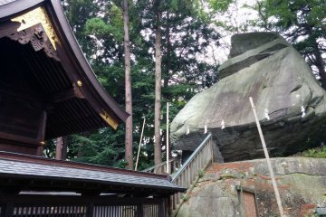 <p>In the back of the shrine, a huge rock the shape of samurai helmet must surely contain some kind of spiritual energy</p>