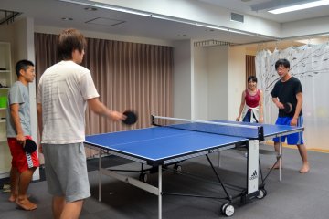 <p>Late night table tennis game at the social studio</p>