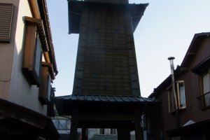 Walk beneath the tower to access the small and quaint Yakushi Shrine
