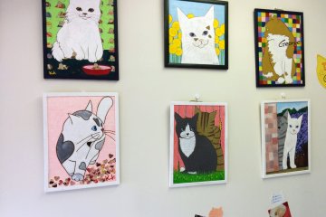 <p>Cat art on the far wall</p>