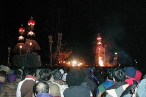 The pyre, prior to it burning. The flames below are torches held by the attacking men.