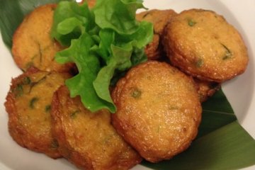 Golden fried fish cakes seasoned with Thai herbs.