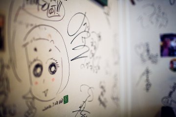 <p>The walls of the cafe are covered with the signatures and scribbles of famous actors, performers and comedians</p>
