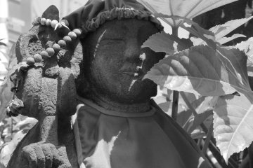 Even statues use prayer beads.