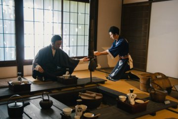 <p>A scene of sake brewers tasting their sake</p>