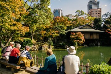 <p>Tourist enjoy the peaceful atmosphere of Sorakuen Garden</p>
