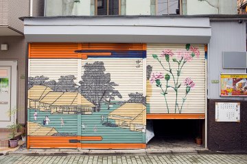 <p>A half-opened shutter allows a curious peek into this shop front</p>