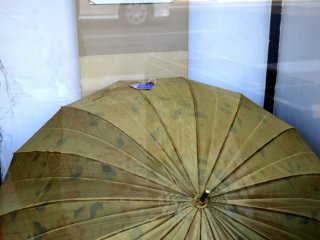 A very beautiful umbrella in a shop window.