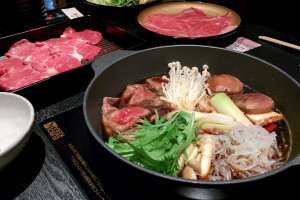 Sukiyaki and prepared meats waiting to be cooked