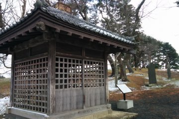 <p>The Tsubo no Ishibumi (壺の碑) is housed inside this wooden building. It was made in 762 to mark the area where Taga Castle was constructed</p>