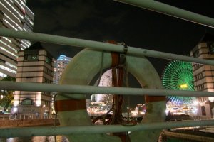 Artistic view of The Pan Pacific, peeking out behind the life preserver. It's beautiful blue top can be seen from afar.