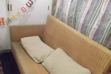 <p>This bar somehow finds room for a comfy-looking couch</p>