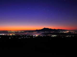The view from Shirakimine Highland in Isahaya City, Nagasaki. Mount Unzen against a star-sprinkled blue twilight sky made me speechless!