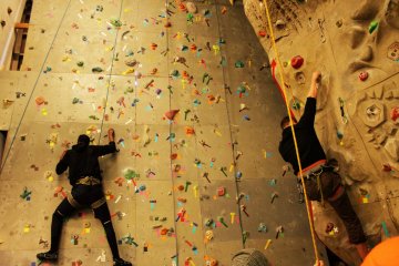 <p>Two climbers heading up the wall.</p>