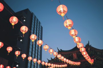 <p>Glowing lanterns feel out of place amongst the Yokohama metropolis</p>