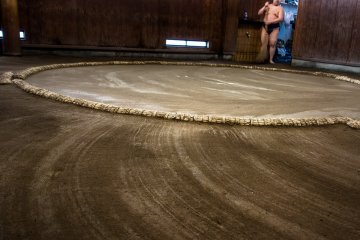 <p>A skillfully swept Sumo ring closes their morning training session</p>