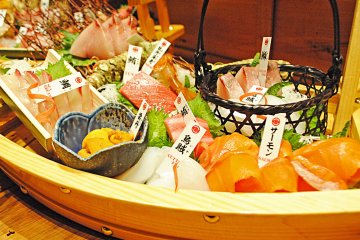 <p>An assortment of helpfully labeled sashimi</p>