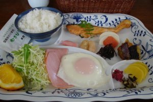 Japanese breakfast, includes miso soup and fruit with yoghurt
