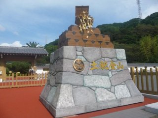 Entrance to Toi Gold Mine. There is a ticket window to the left and the entrance behind is guarded by a Samuri doll who actually moves and speaks when you get near.