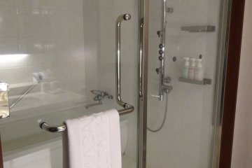 <p>The bathrooms offered tons of space, with a separate (huge) stall for shower and tub</p>