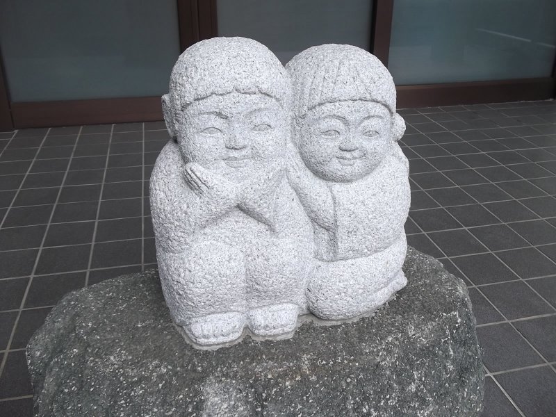 <p>This cute couple are sitting in front of one of the outer buildings</p>