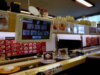 Order the kind of sushi you want from the touch screen