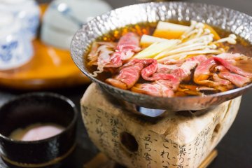 <p>Hida beef sukiyaki simmering over a fire</p>