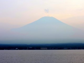 A small puff of cloud hovered above Fuji&#39;s peak