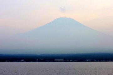 <p>A small puff of cloud hovered above Fuji&#39;s peak</p>