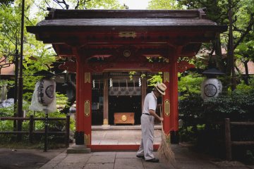 <p>Grounds keeper sweeping the path for the gods to walk</p>