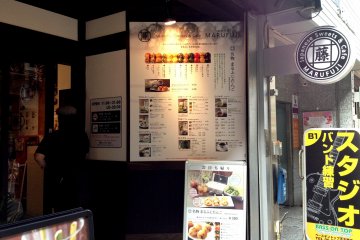 <p>Located in a quiet pedestrian friendly alley, Marufuji tempts you with its menu board outside.</p>
