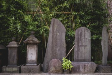 <p>Tomb stones lining the temple</p>
