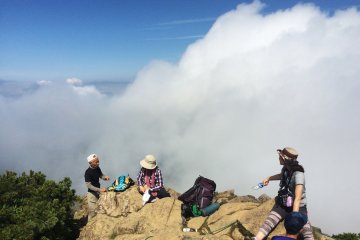 <p>Hikers take a rest at the mountain top of Mt. Shibutsu.</p>