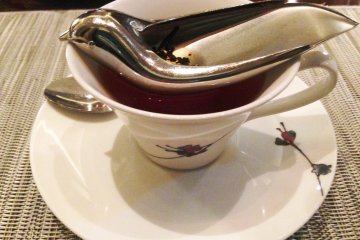 Luxury comes in delightful touches, such as their bird shaped tea strainer.