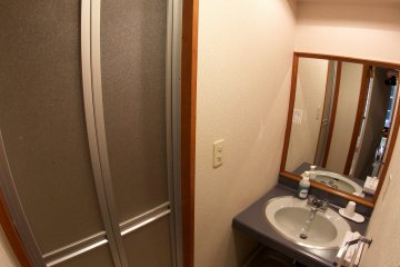 <p>Each room has a sink and a shower area, which includes a bathtub.&nbsp;</p>