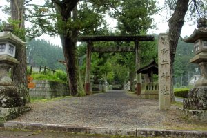 The entrance torii and sign of Mii Shrine