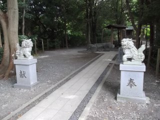 Lions guarding the shrine in the woods