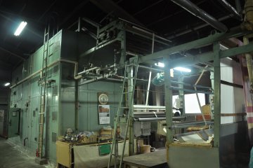 <p>In the modern way of drying, the cloth is fed into the machine to be dried</p>