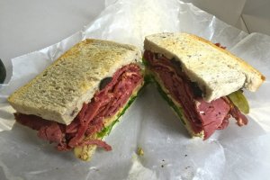 A New York pastrami sandwich on whole wheat bread