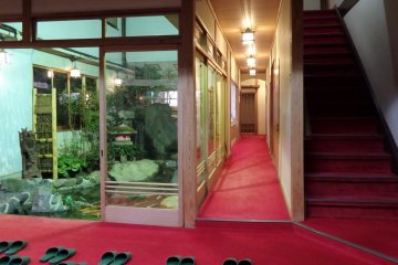 <p>There is a lovely garden and fish pond in the very center of the ryokan.</p>