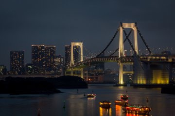<p>Rainbow Bridge, Yakatabune pleasure boats and skyline at night, as seen from Odaiba</p>
