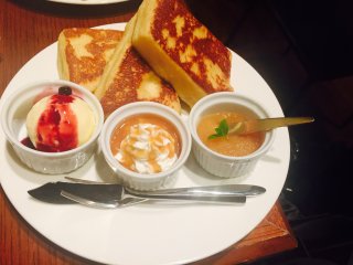 The French toast sampler with caramel sauce, apple cinnamon sauce, or ice cream with blueberry sauce.
