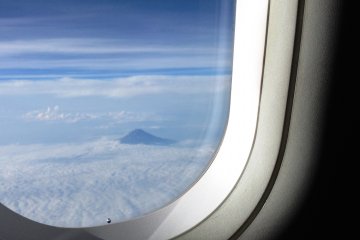 You can see a glimpse of Mount Fuji from the left hand side going from Osaka to Narita.

