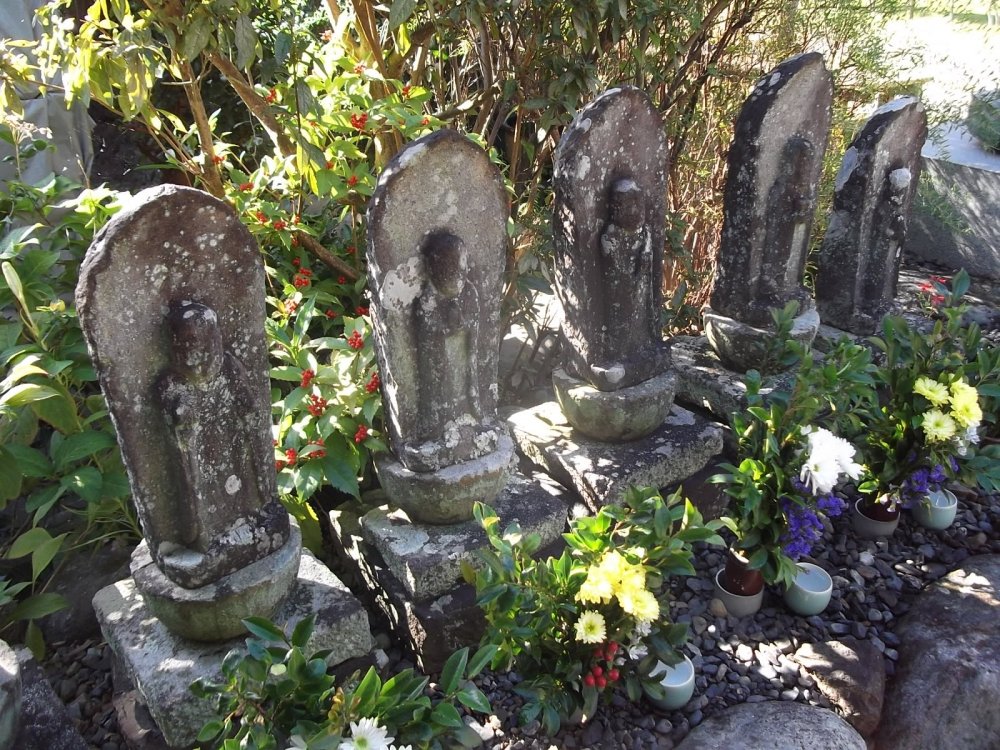 Some weathered old Buddhist statues
