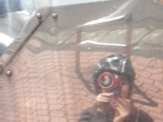 My reflection in the mirror-like propeller installation  as it swung towards me, overhead