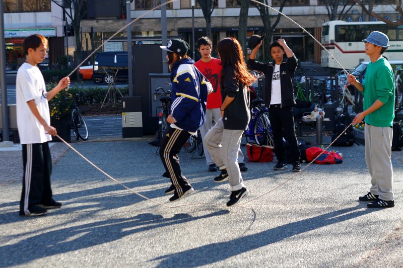 A couple of youths doing their Double Dutch practice on a Sunday afternoon in winter