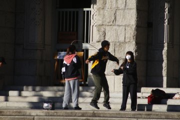 Some other kids playing the Double Dutch just outside the Kyoto City Hall