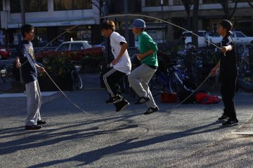 Two more teenagers practicing their Double Dutch on Sunday afternoon outside Kyoto City Hall