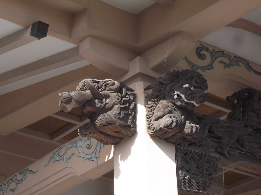 A boar (I think) and a lion under the eaves